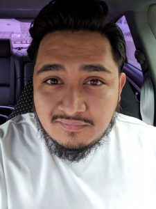 Photo of a man in his car.